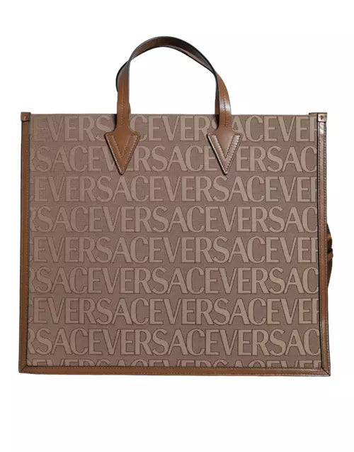 Sac fourre-tout à bandoulière en cuir jacquard marron avec poignée supérieure et logo Versace